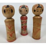 3 vintage wooden hand painted Japanese Kokeshi dolls. With hand painted signature marks to