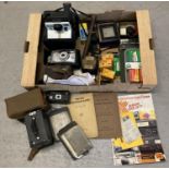 A box of assorted vintage camera equipment & ephemera. To include a Poleroid Instamatik camera,