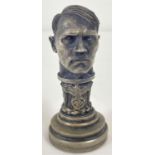 A modern cast metal seal in the form of Hitler's head with eagle and swastika insignia. Approx.