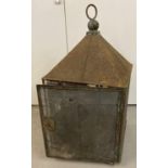 A Victorian metal framed hanging meat safe with mesh sides and opening door with lock. Complete with