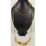 2 vintage amber glass bead costume jewellery necklaces. A 16" graduating faceted bead necklace