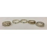 5 silver and white metal stone set band style rings in varying sizes and designs. Ring sizes L, P,