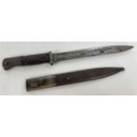 A WWII German wooden grip bayonet with sheath. Marked to blade cof 43 and 4336 r.