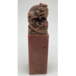 A Chinese soapstone seal with carved dragon shaped finial. Approx. 12cm tall.