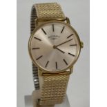 A men's slimline gold tone cased wristwatch by Rotary with expanding bracelet strap. White face with