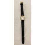 A ladies wristwatch by Raymond Weil, Geneve with 18ct gold plated case and buckle. Oval shaped