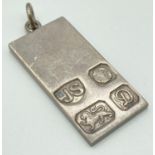 A vintage silver ingot pendant with hallmark detail to front - Sheffield 1978. Approx 4.75 x 2cm