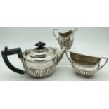 A Victorian silver James Deakin & Sons 3 piece bachelor tea set of classical design. Each piece