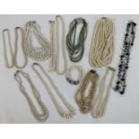 A collection of 12 vintage faux pearl necklaces in varying colours and lengths. To include double
