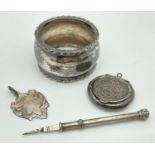 A small collection of silver, silver plate and white metal items. A silver circular pill box with