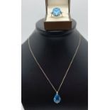 A Swarovski blue crystal and silver pendant style necklace together with a decorative swivel top