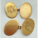 A pair of vintage 9ct gold oval shaped cufflinks engraved with 'M.E.L' monogram. Total weight