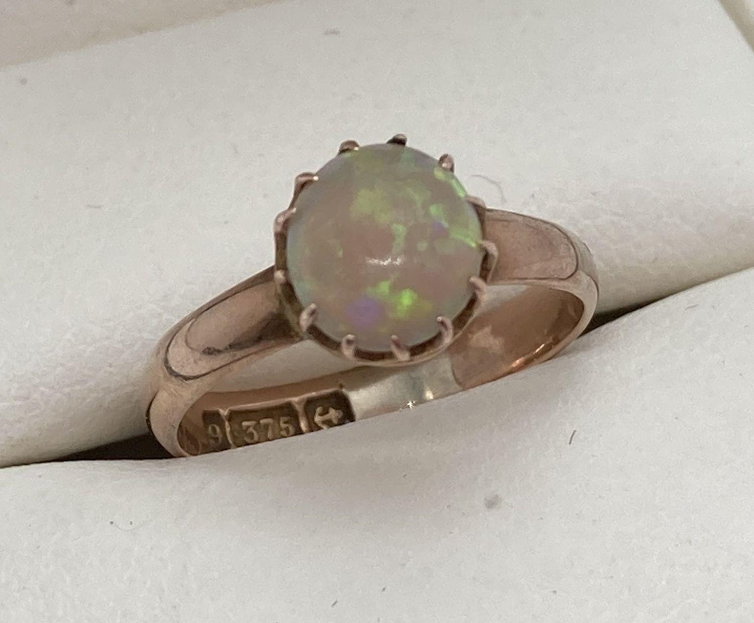 A child's vintage Opal set 9ct gold ring. Fully hallmarked inside band, with Birmingham assay