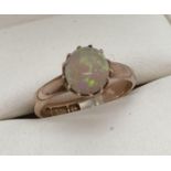A child's vintage Opal set 9ct gold ring. Fully hallmarked inside band, with Birmingham assay