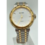 A Sekonda wristwatch with two tone stainless steel strap and case. White face with gold tone hour