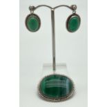 A Scottish silver brooch set with green banded agate together with a pair of matching drop earrings.