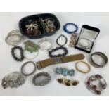A collection of 40 vintage and modern bracelets and bangles. To include glass bead, charm,