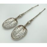A pair of Victorian Silver Mappin & Webb highly decorative serving spoons. Hallmarked to reverse
