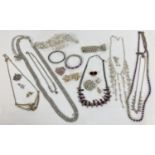 A collection of vintage and modern diamante and stone set costume jewellery to include necklaces,