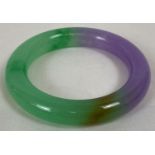 A chunky lavender jade bangle of green and lilac tones. Approx. 8.5cm diameter, 6cm inner diameter.