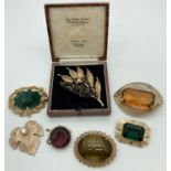 A collection of 7 large 1960's & 70's stone set brooches in gold coloured mounts. To include