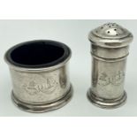 An Art Deco silver cruet with engraved detail featuring the crests of Clans Home & Henderson. A