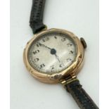 A 1930's 9ct gold cased ladies wristwatch with black leather strap. Hallmarked for Chester, 1933.