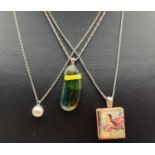 3 modern design pendants on silver chains. An art glass pendant on a 16 inch silver rope chain, a