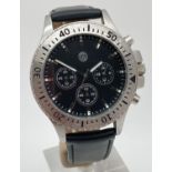 A VW men's chronograph style wristwatch with black leather strap. Stainless steel case with rotating