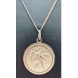 A vintage silver circular shaped St. Christopher pendant on an 18" fine curb chain with lobster