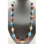 A 24" costume jewellery necklace made from multi-coloured Venetian style glass beads. With gold tone