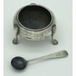 A Victorian silver 3 legged salt with matching spoon, both have engraved pattern detail. Both pieces