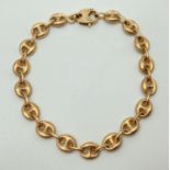 A 9ct hollow gold puffed anchor/mariners link bracelet with lobster style clasp. Full hallmarks to
