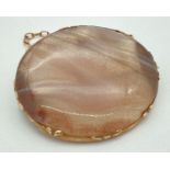A vintage natural agate oval shaped brooch in a gold mount. Complete with safety chain. Mount