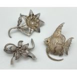 3 vintage silver filigree brooches. A flower with bow design, an Angel fish and a stemmed flower.