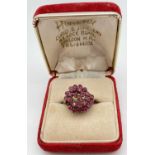 A 14ct Chinese gold and ruby vintage domed style cluster ring. 25 small round cut rubies set in a