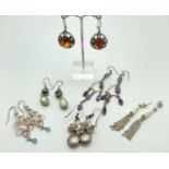 6 pairs of silver and white metal drop style earrings. To include amber and amethyst set.