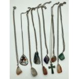 A collection of 14 assorted vintage natural stone pendant necklaces. To include amethyst, moss