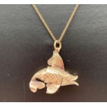 A 9ct gold fish pendant on a 9ct gold 19" fine curb chain with spring clasp. Bottom fin to fish