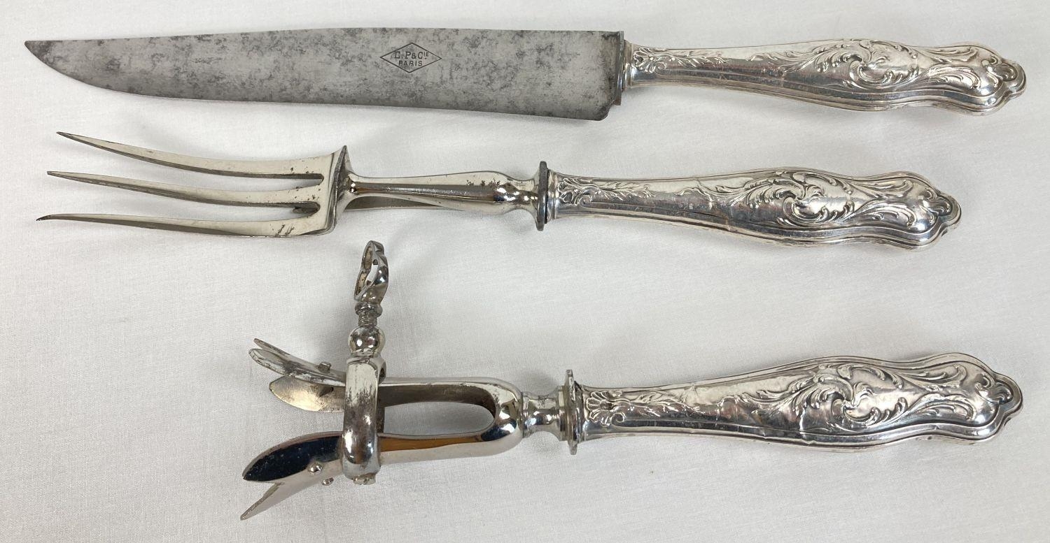 A Victorian white metal handled carving set to include a leg joint holder. Named to blade of knife