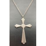A large vintage silver decorative cross pendant on a 22 inch fine belcher chain. Pendant marked