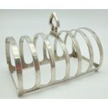 An Art Deco Mappin & Webb silver 6 slice toast rack of curved form, fully hallmarked, Sheffield