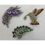 3 large costume jewellery statement brooches. An enamel and stone set humming bird, a leaf design