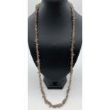 A 32" costume jewellery necklace of Smokey quartz chips. Ex jewellery makers stock.