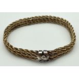 A vintage triple rope chain design silver gilt bracelet with push clasp and safety clip. Approx 8