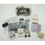 A collection of 50+ pairs of vintage and modern costume jewellery earrings in varying styles. Mostly
