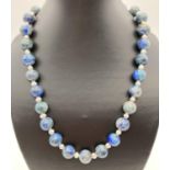 An alternating lapis lazuli and fresh water pearl 20" necklace, with silver tone T bar clasp. Ex