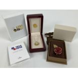 2 boxed items of poppy day commemorative jewellery. A Flanders Fields WWI Centenary poppy pendant on