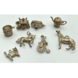 8 vintage silver and white metal charms. A horse, a man riding a penny farthing cycle, a teapot (