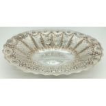 A large Victorian silver decorative bon bon dish with pierced work panel detail. Engraved to inner